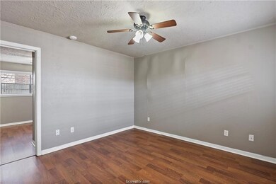 Unfurnished bedroom featuring a textured ceiling,