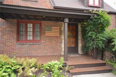 Quaint Front Porch with Wisteria Screen