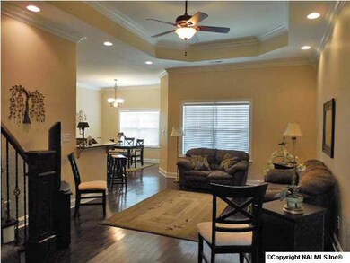 Family Room features hardwood floors, recessed lighting, trey ceilings, and a great open flow to the kitchen/dining areas.