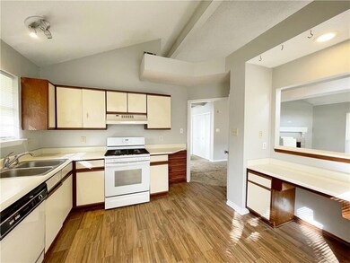 Kitchen with desk and Breakfast Bar.