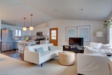 Updated family room with recessed lighting and vau