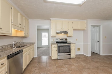 Kitchen with sink, appliances with stainless steel
