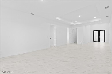 Spare room with recessed lighting, visible vents,