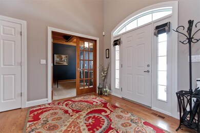 Open front entry with double coat closet and frenc
