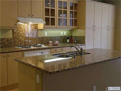 Large island with beautiful granite countertop.