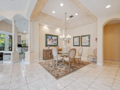 Dining area with light tile patterned floors, rece