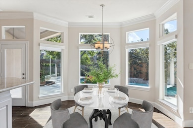 What a happy breakfast area.  Look at all those windows with beautiful views of the pool.  Digitally staged.