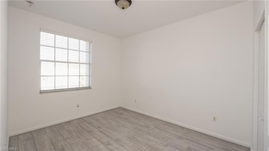 Spare room with light wood-style flooring, baseboa