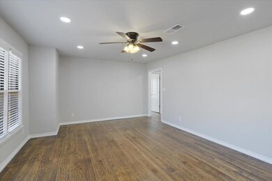Unfurnished room featuring dark hardwood / wood-st