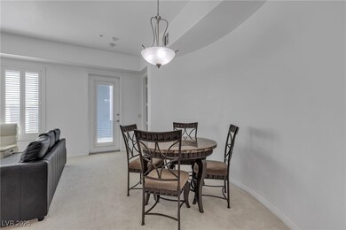 Dining room featuring light carpet and baseboards