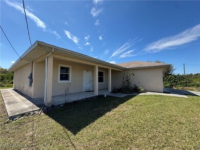 Ranch-style home featuring a front yard, a patio,