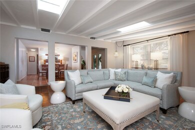 Tiled living room with beamed ceiling