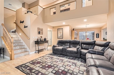 Living room featuring light wood-type flooring, st