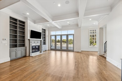 2nd floor features large living room space with fireplace and large built ins.