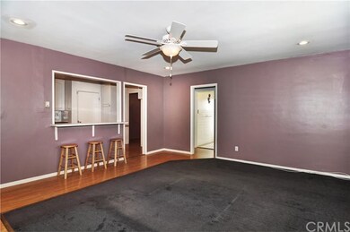 Living room looking at kitchen and pass through ba