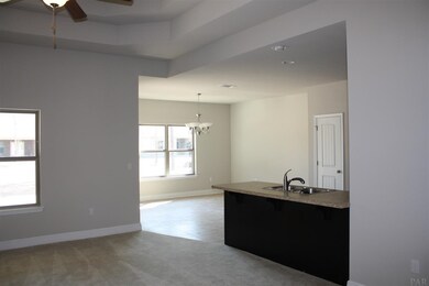 open family room to the kitchen and dining