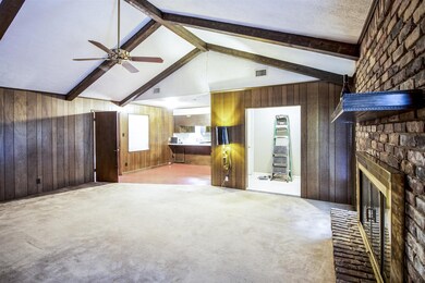 Living room open to kitchen/breakfast area.