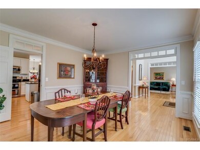 Full-size dining room with wainscoting and crown m