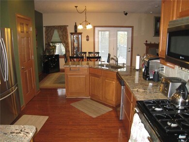 Kitchen with granite countertops and stainless app