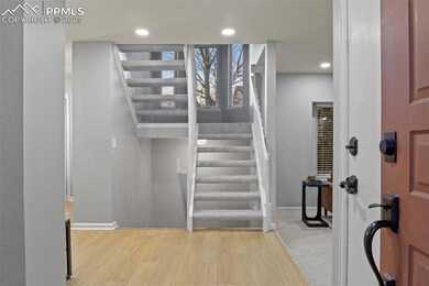 Staircase with recessed lighting, baseboards, and 