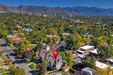 View of property location featuring mountains and nearby suburban area