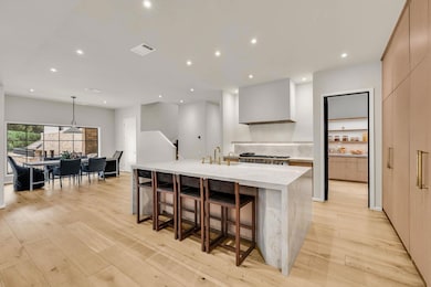 Kitchen featuring modern cabinets, recessed light