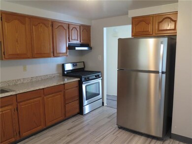 Kitchen 2nd with New refrigerator and gas stove