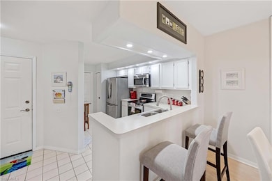 Kitchen featuring stainless steel appliances, a si