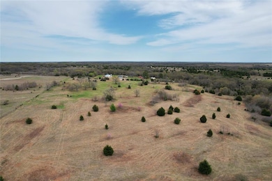 Birds eye view of property with a rural view