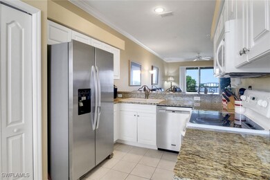 Kitchen featuring stainless steel appliances, a si