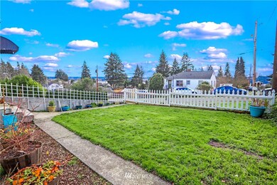 Front yard is fenced and offers the water view