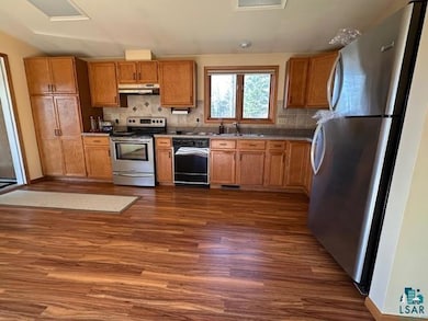 Kitchen with appliances with stainless steel finis
