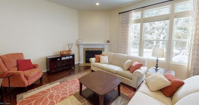 View of living room with neutral palette, gas fire