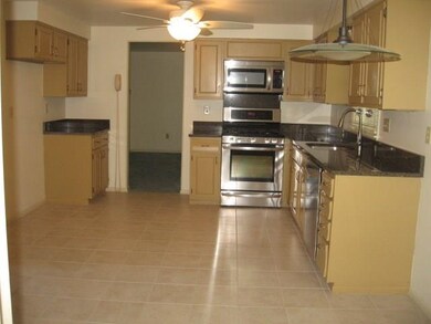 Kitchen with Stainless Steel gas stove, microwave 