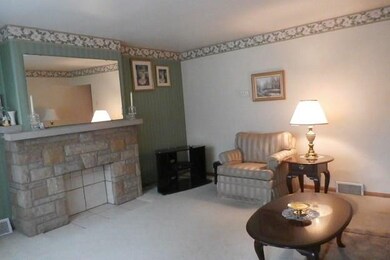 Living room with decorative fireplace