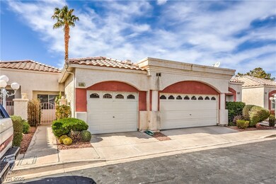 Mediterranean / spanish home with a garage, a tile
