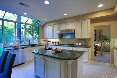 A close up of the kitchen with island counter, veg