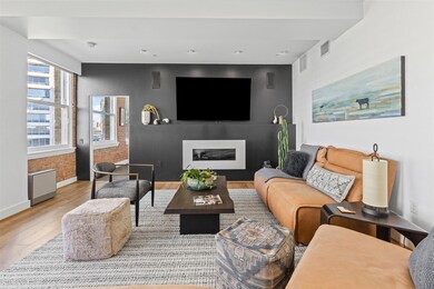 Living area featuring recessed lighting, wood fini