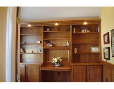Den. Custom built bookcases come with this beautif