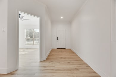 Entryway featuring wood finished floors, crown molding, recessed lighting, and ceiling fan