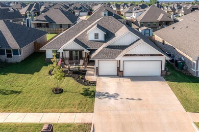 Craftsman-style home with a garage, a front lawn, 