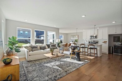 Living room featuring dark wood-style floors and recessed lighting