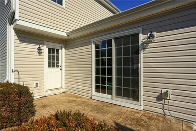 Utility door and sliders lead out to Stamped side