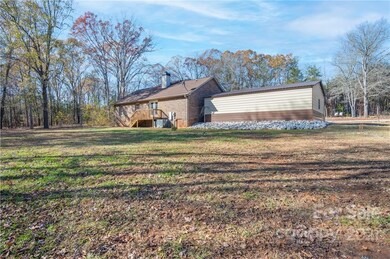 Back of home with small deck 