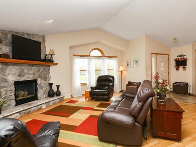 Vaulted ceiling, beautiful stone fireplace make th