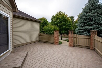 Tiled patio with mature trees for privacy