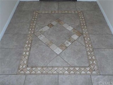 Decorative tile in entry way.