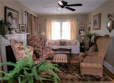 Roomy Living Room Allows for Cozy Chats by the Gas
