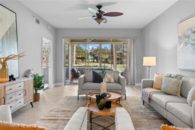 Living room with baseboards, ceiling fan, and ligh
