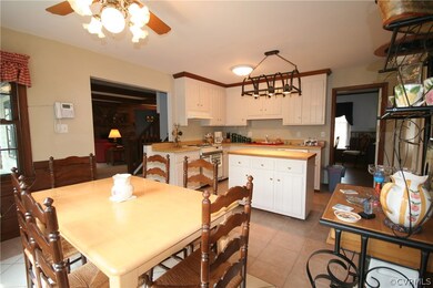 SPACIOUS KITCHEN WITH WOOD TOP ISLAND, TILE FLOORI